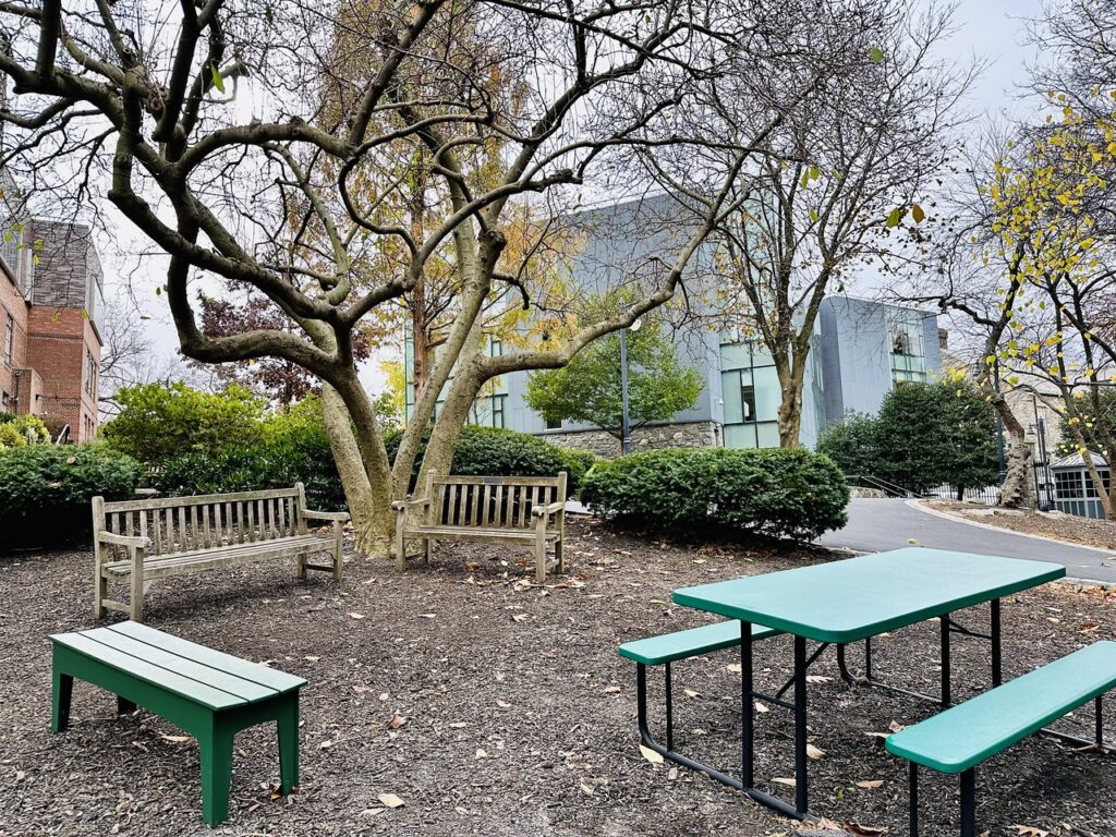 Outdoor shot of benches and picnic table at Fieldston Lower.