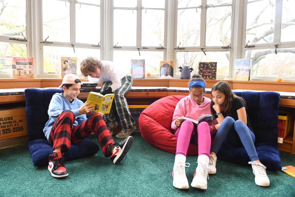 Ethical Culture Fieldston School 5th graders share books in the library