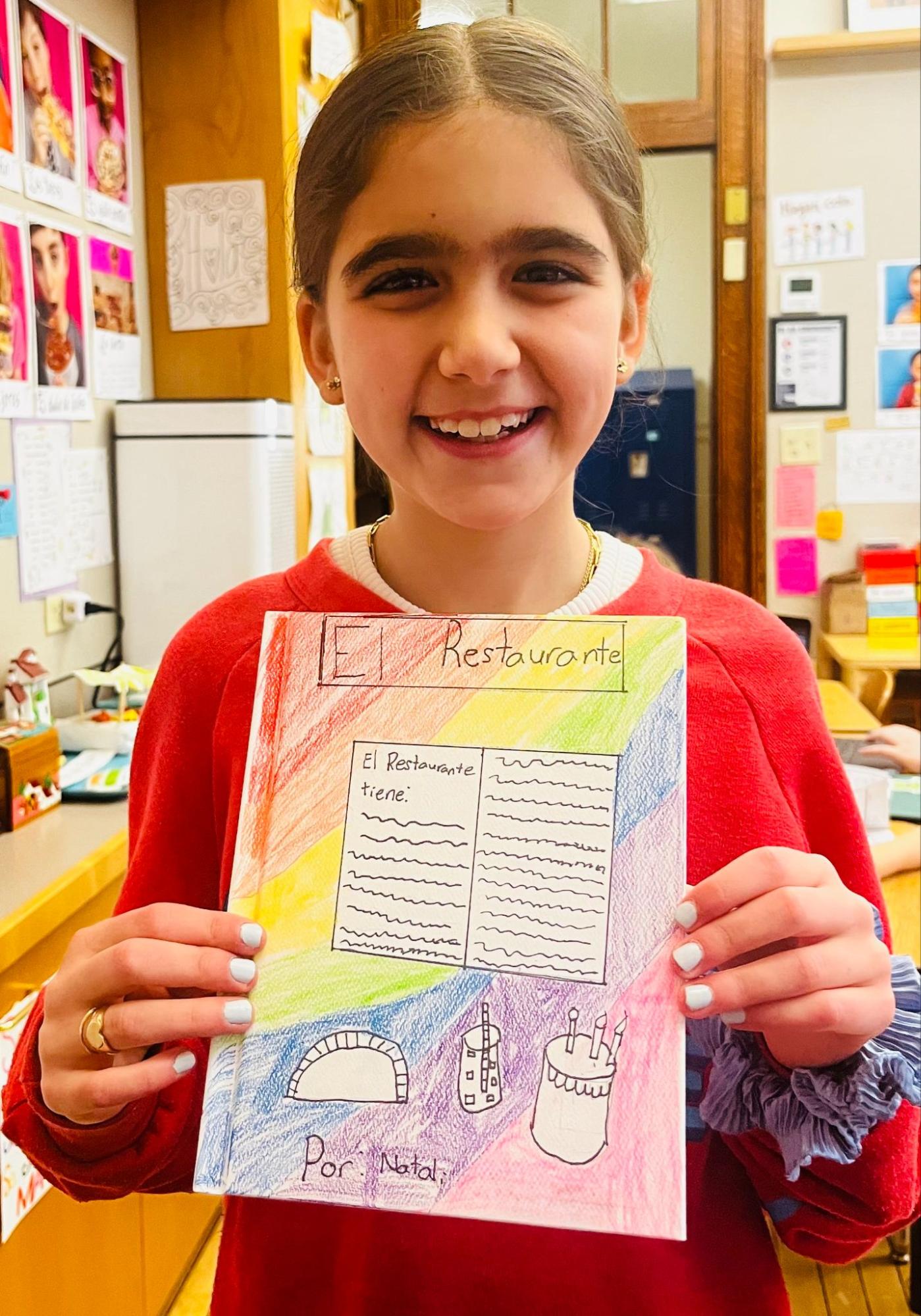 Ethical Culture student with Spanish book