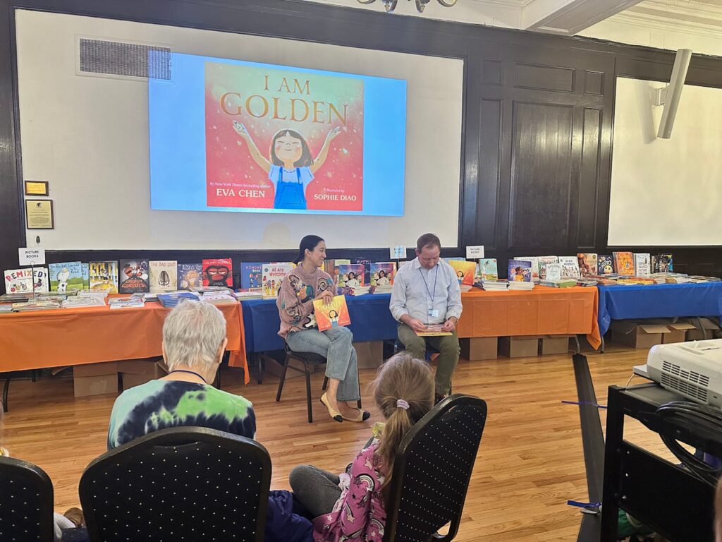 Author Eva Chen sits in conversation with Assistant Principal for Student Life Erik Landgren as audience looks on.