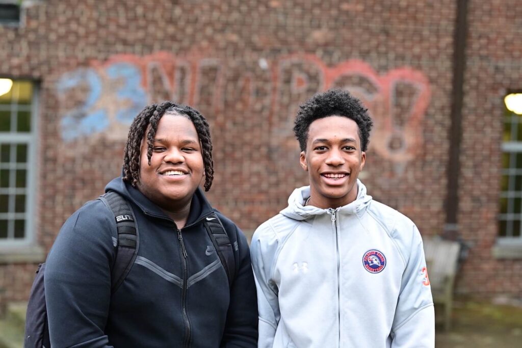 Two Ethical Culture Fieldston School Upper School students smile at the camera