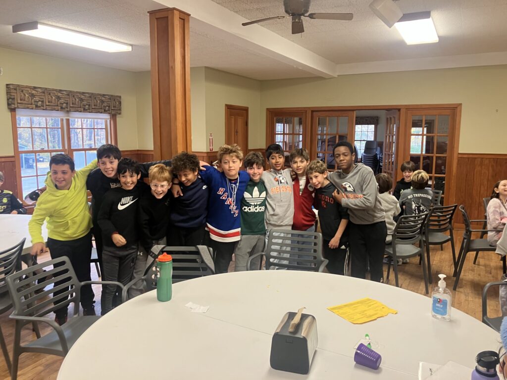 Students pose together inside the dining hall at Nature's Classroom.