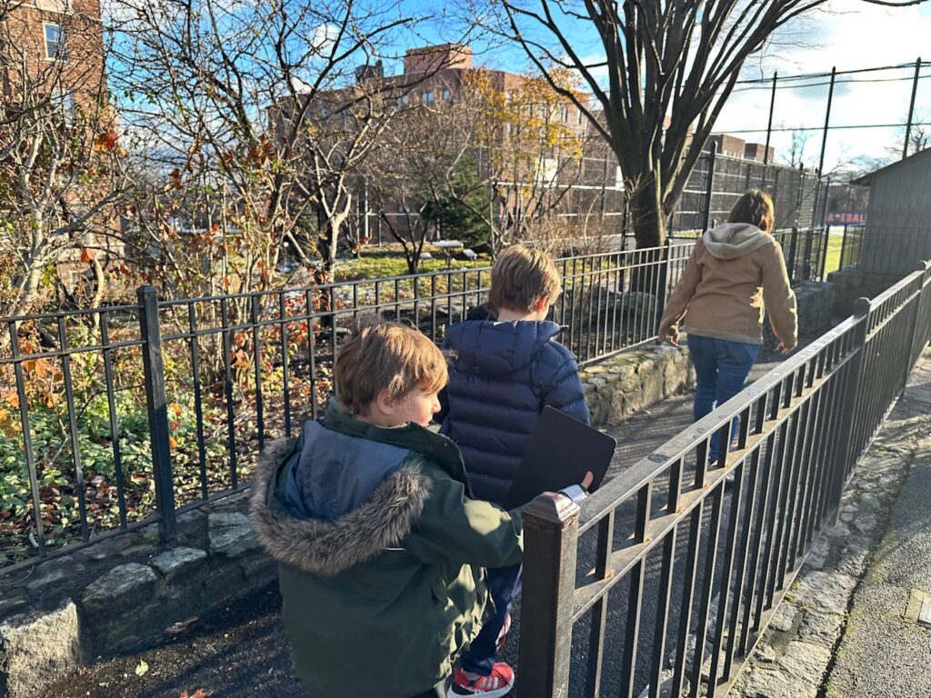 Students scout locations outside to take pictures.