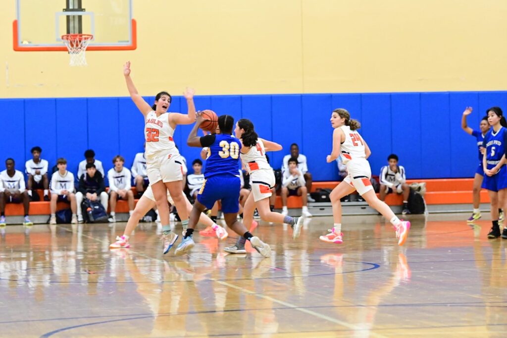 Fieldston Upper's girls varsity basketball team plays a game in the Varsity Gym.