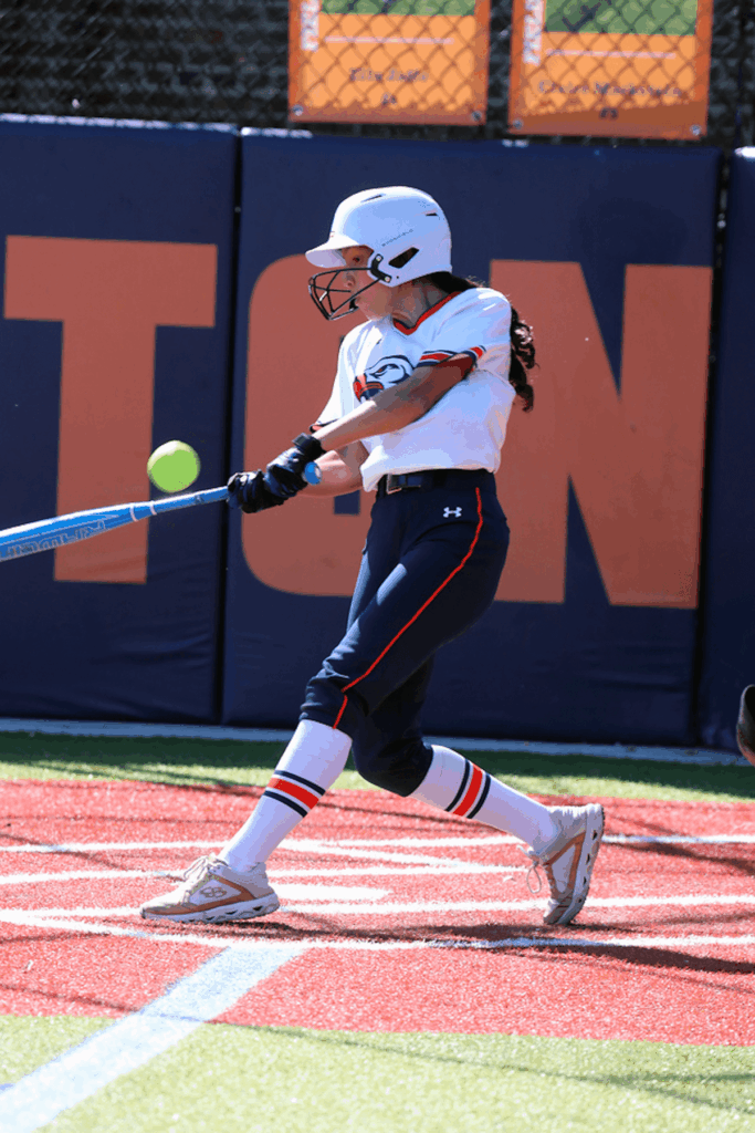 An Ethical Culture Fieldsotn softball player plays at Spring Fling.