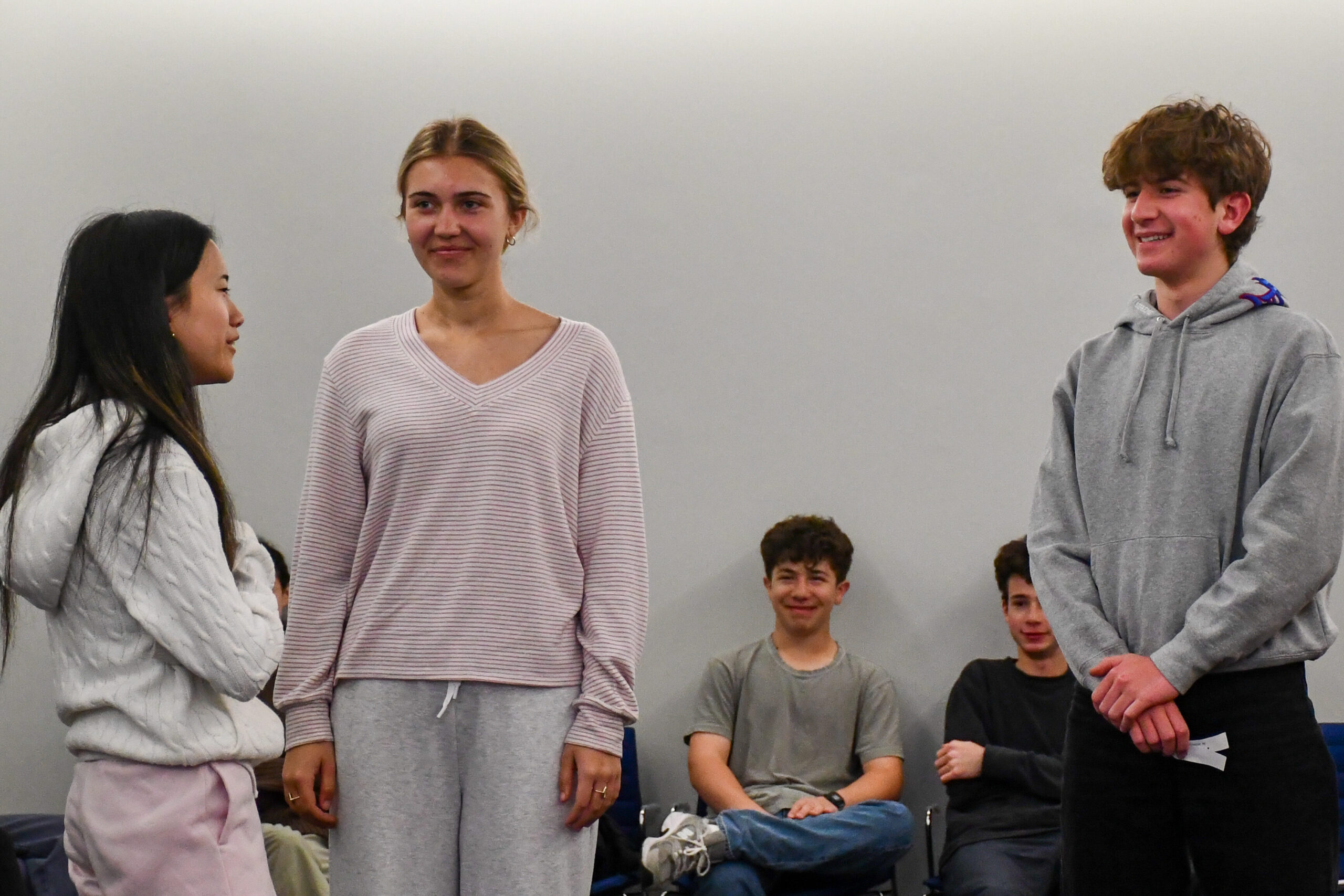 Fieldston Upper PLOP students participate in a training activity during a meeting. 