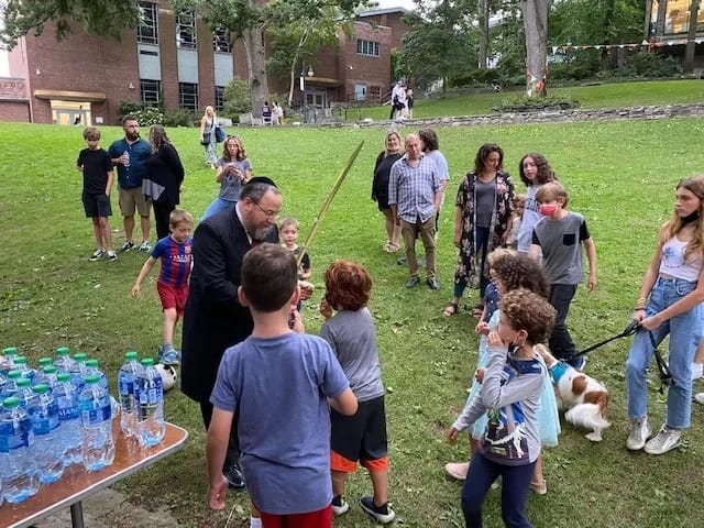 families shake the lulav and etrog