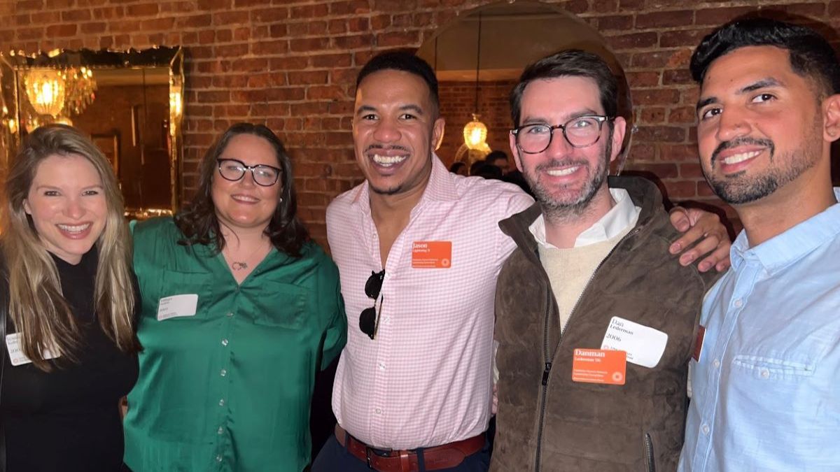 FAN leaders Jason and Dan pose with fellow ECFS alumni at the Thanksgiving Eve social.