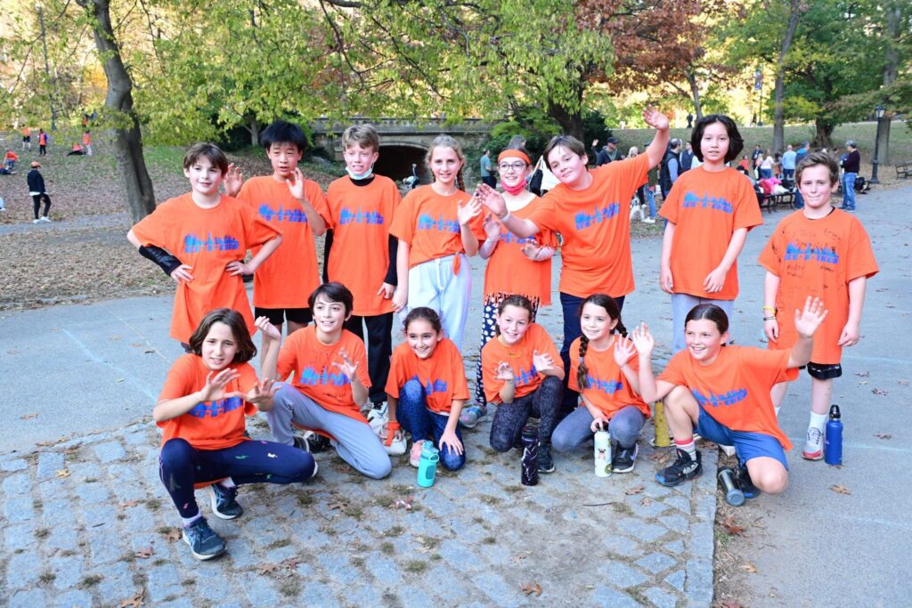 group of fifth graders poses together scaled 1
