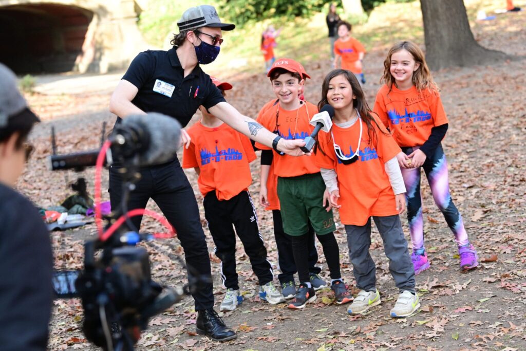 kids are interviewed for a live stream of the event scaled 1