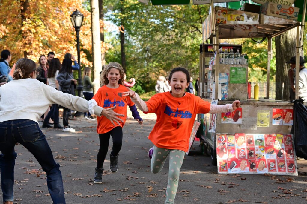 kids high five as they run past scaled 1