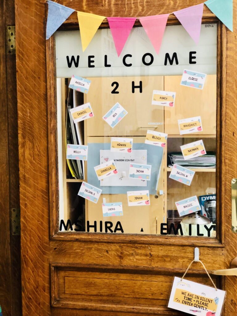 sign on door that says welcome 2H scaled 1